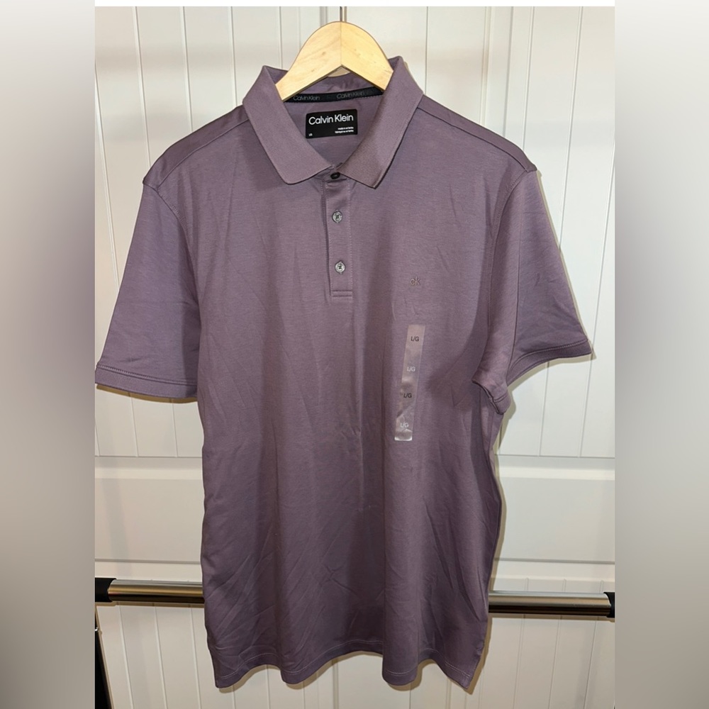 Calvin Klein polo shirt. New without tags. Size large, brand new condition.